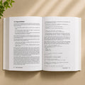 JavaScript: The Definitive Guide 7th Edition open book showing interior pages with JavaScript code examples and property documentation